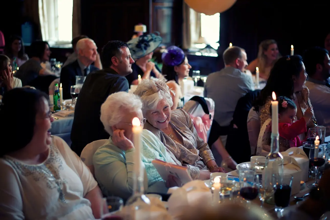 Wedding dinner entertainment with live acoustic vocalist providing elegant background music during wedding breakfast