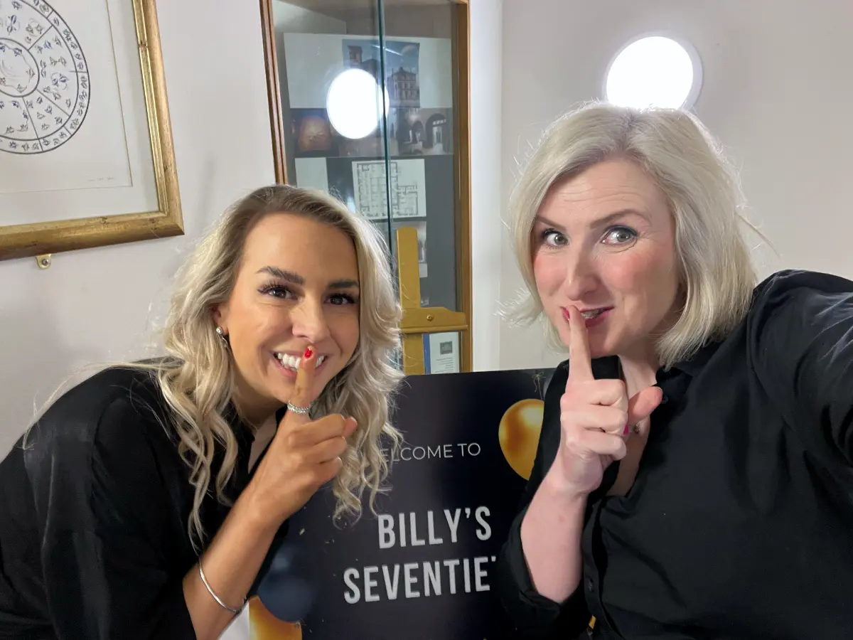 Female surprise wedding singers disguised as waiters performing unexpected entertainment at Glasgow wedding reception