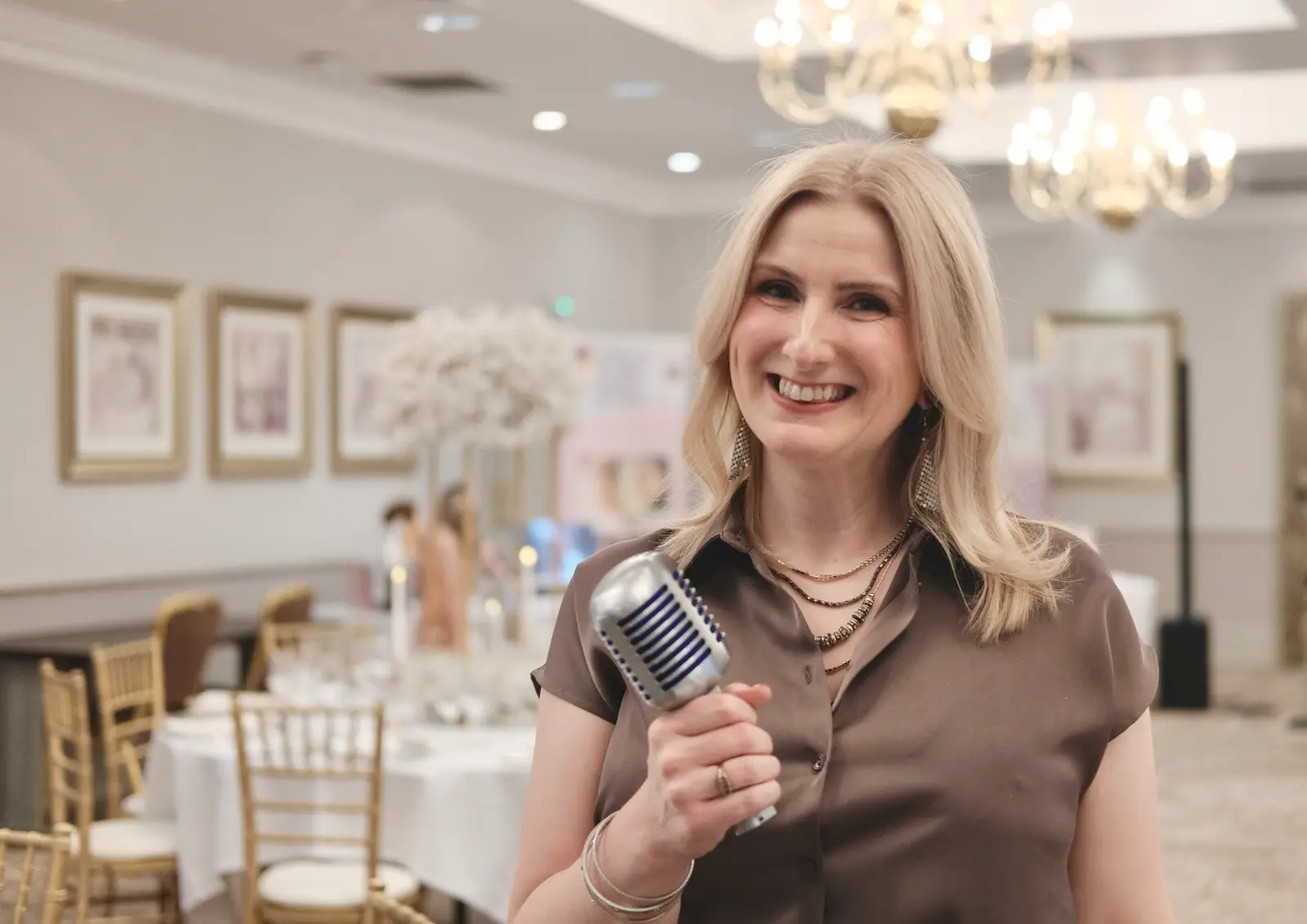 Award-winning female wedding singer Nicola Mason performing live music at Scottish wedding