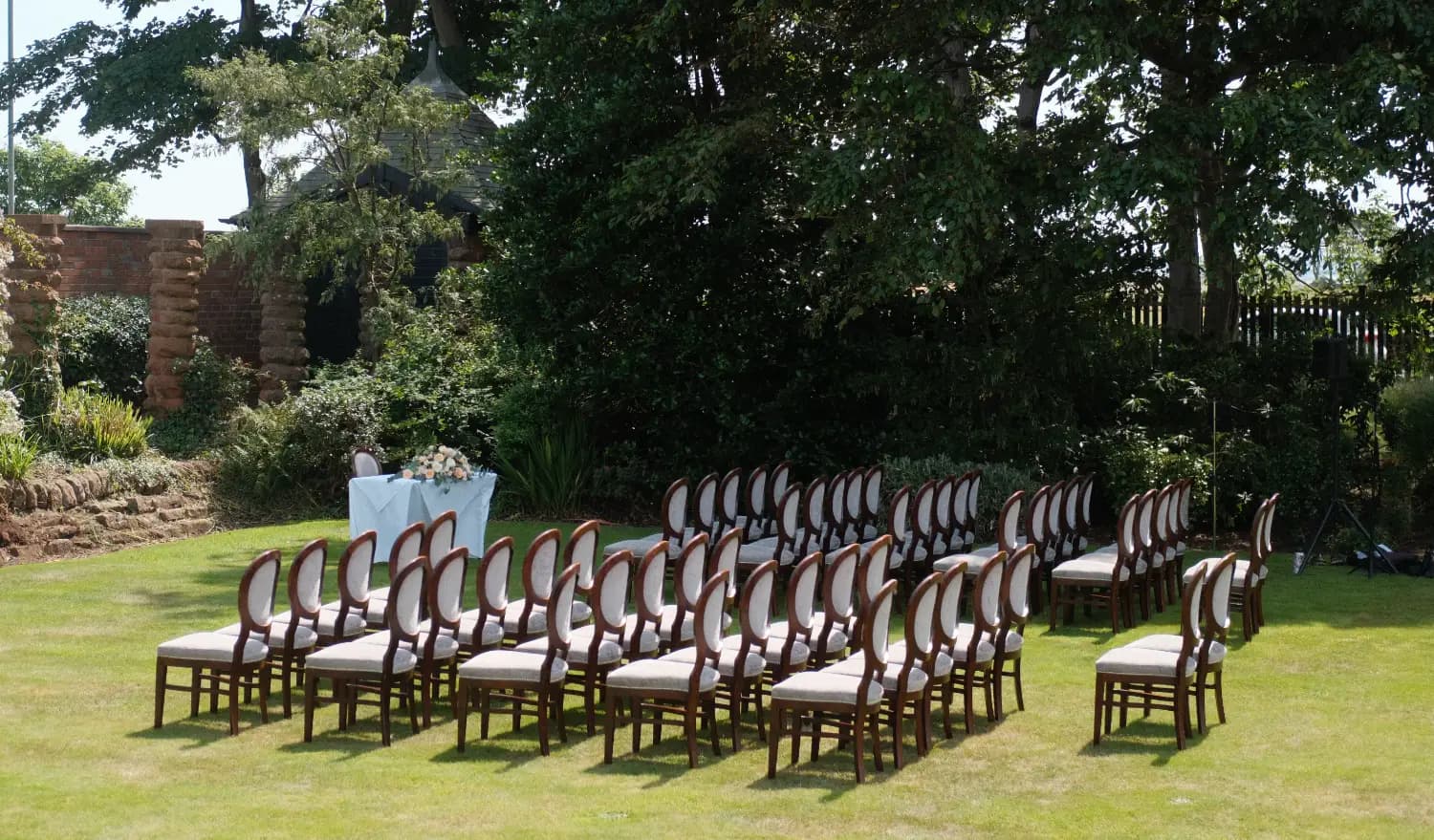 Outdoor wedding ceremony seating set up for live music by Nicola Mason